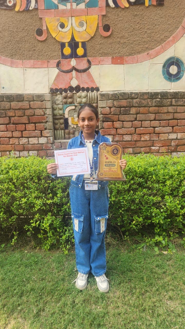 Khushi with award and certificate