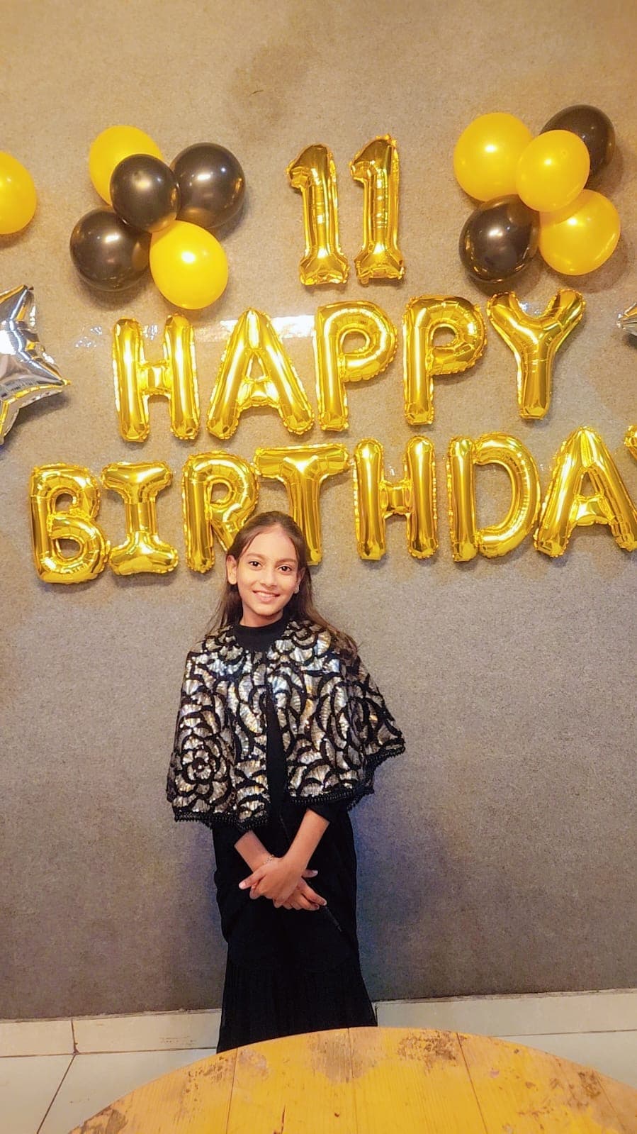 Khushi at her 11th birthday with balloons
