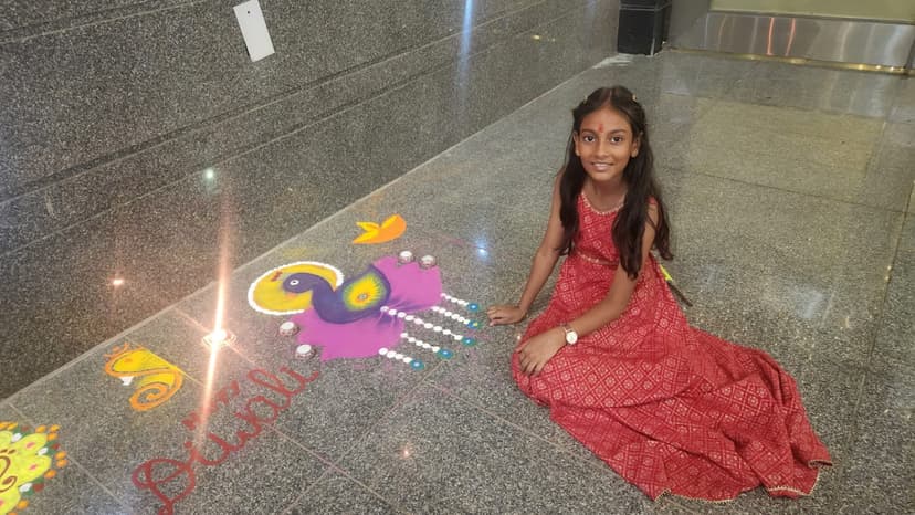 Khushi with her Diwali rangoli