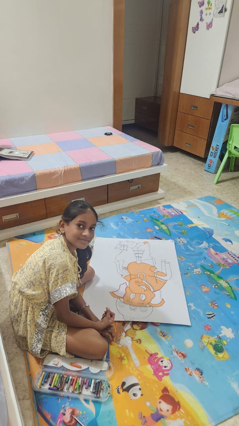 Khushi drawing on the floor