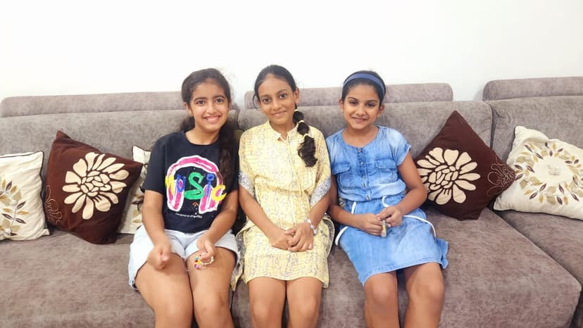 Khushi with friends on the couch