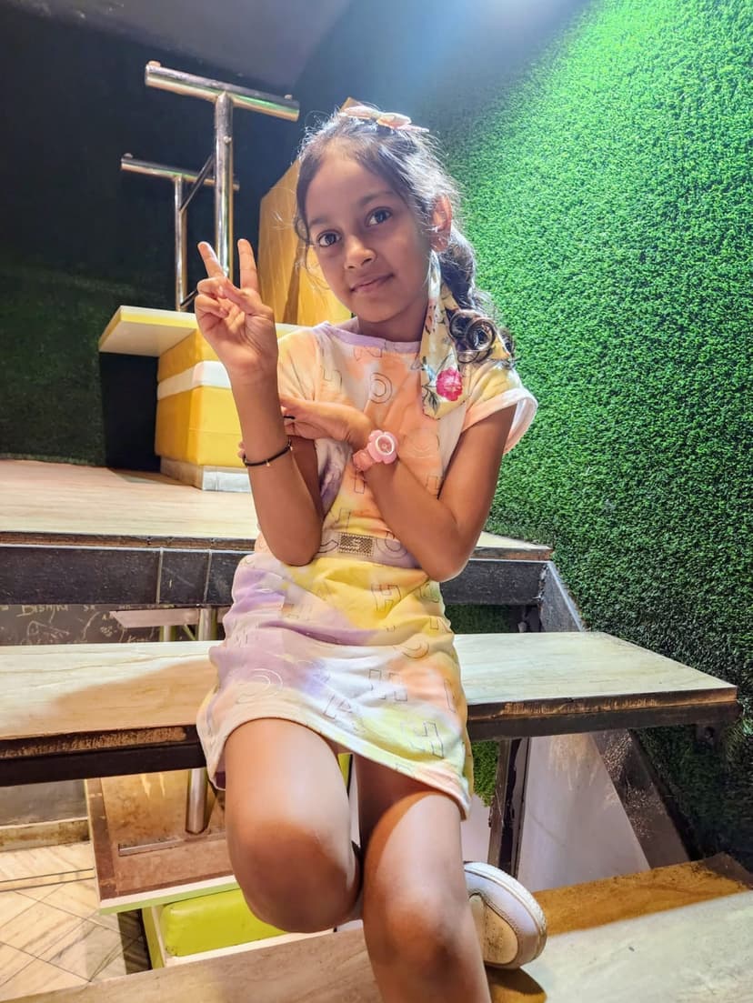 Khushi doing peace sign