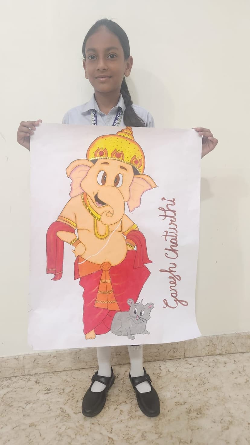 Khushi holding Ganesh drawing in school uniform