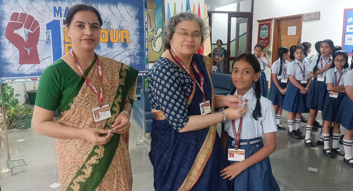 Khushi receiving recognition at OP Jindal Modern School from her teachers